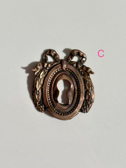 Bow Escutcheons